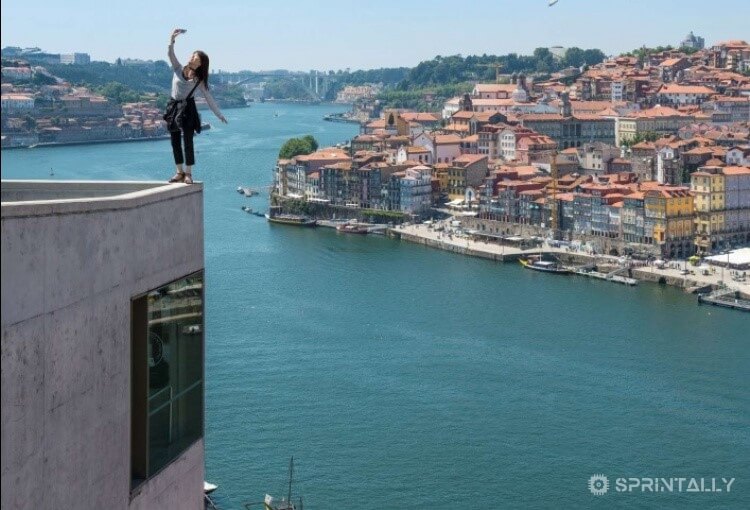 standing on the edge of a tall building