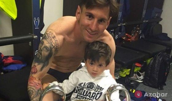 Lionel Messi with his son